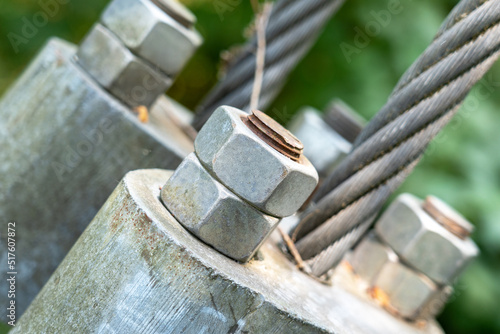 Bolt with a nut fastening the rope of a suspension bridge