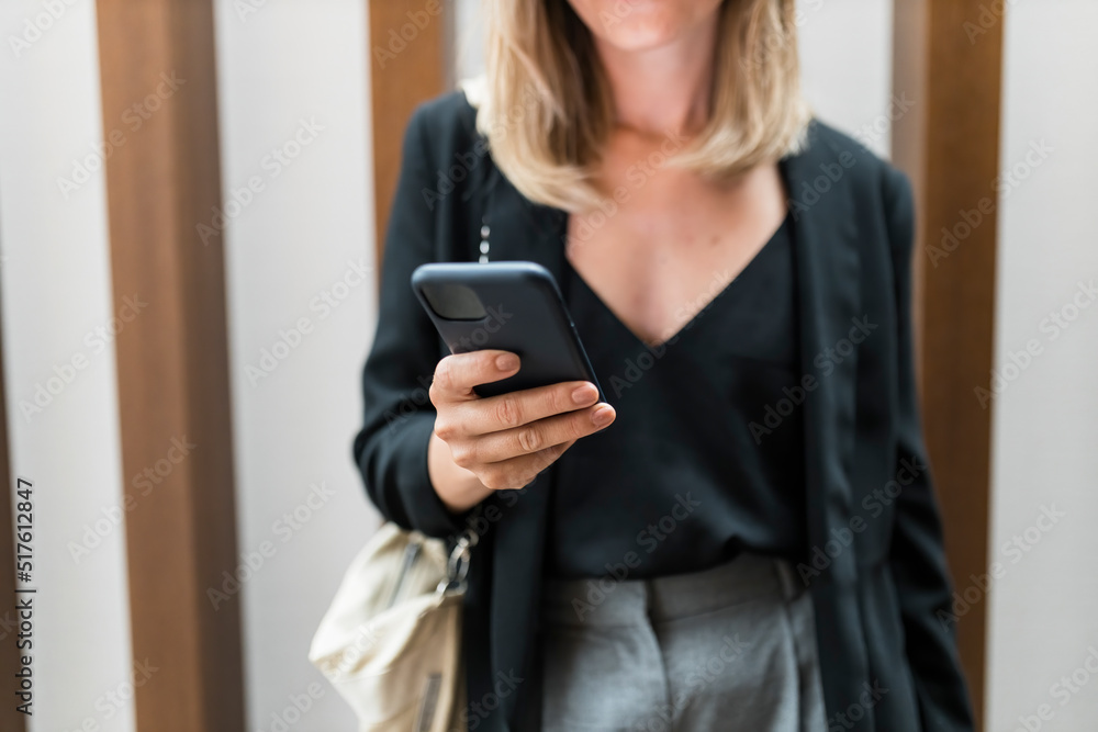 Hands of businesswoman using smart phone in hotel Hands of businesswoman using smart phone in hotel