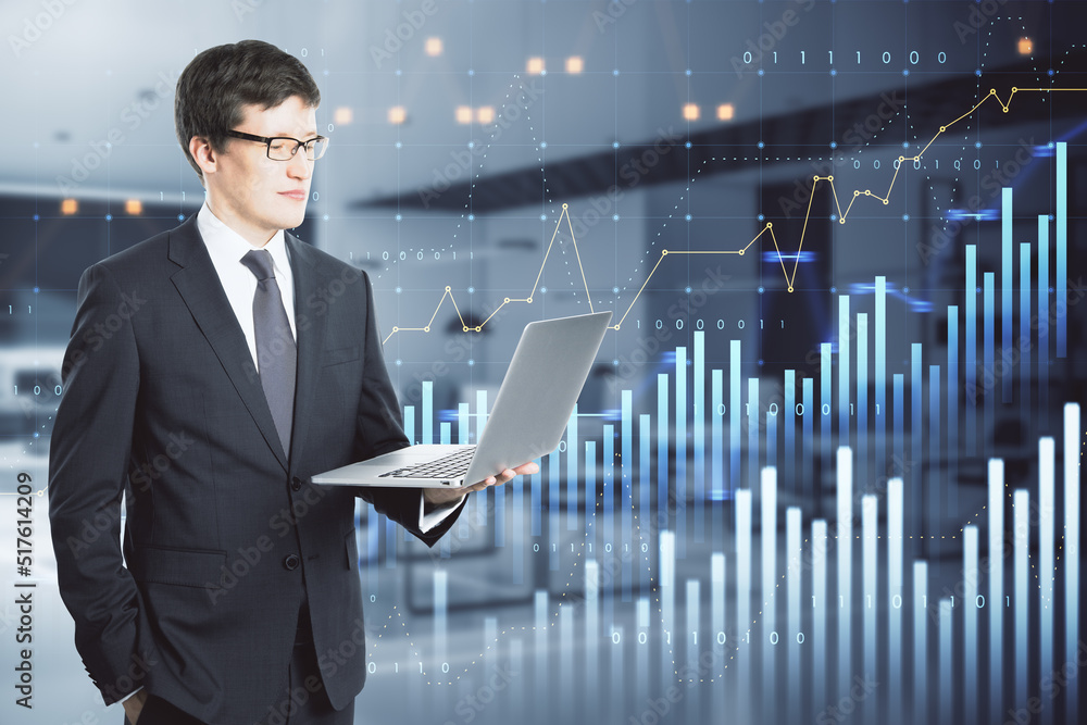 businessman using laptop with abstract glowing and growing business graph hologram on blurry office interior background. Planning and strategy, stock market, business growth, progress businessman using laptop with abstract glowing and growing business graph hologram on blurry office interior background. Planning and strategy, stock market, business growth, progress