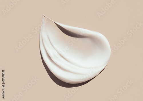 Tela cosmetic smears cream texture on pastel background