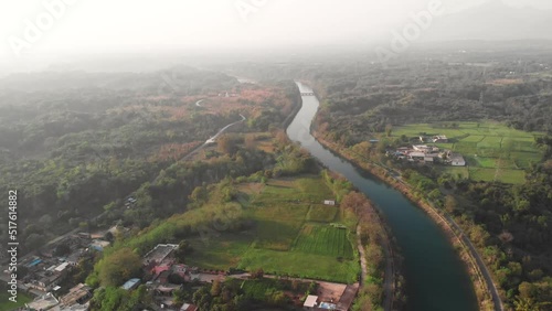 View of crystal clear water of Satluj River is flowing in the middle of the greenery of the Punjab area. photo