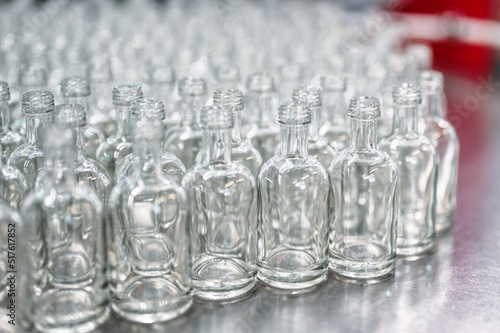 Group of glass bottles for alcohol drink on metal table