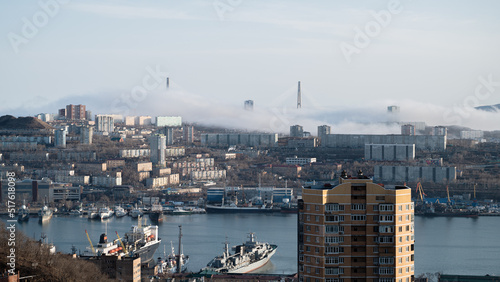 Vladivostok cityscape view. Fog over the city.