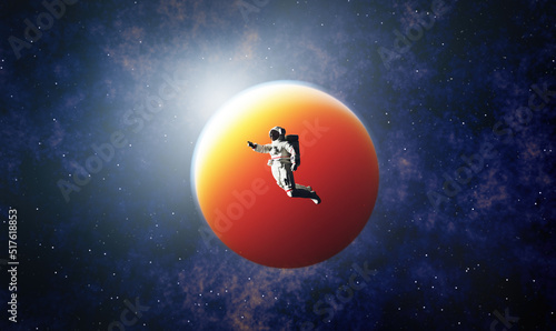 Fototapeta Naklejka Na Ścianę i Meble -  Astronaut spacewalk in space near a planet and pointing his finger.