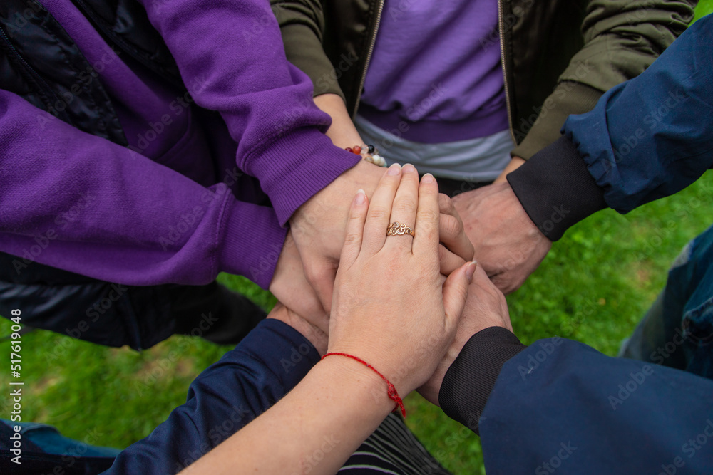 People put their hands together. Selective focus. People put their hands together. Selective focus.