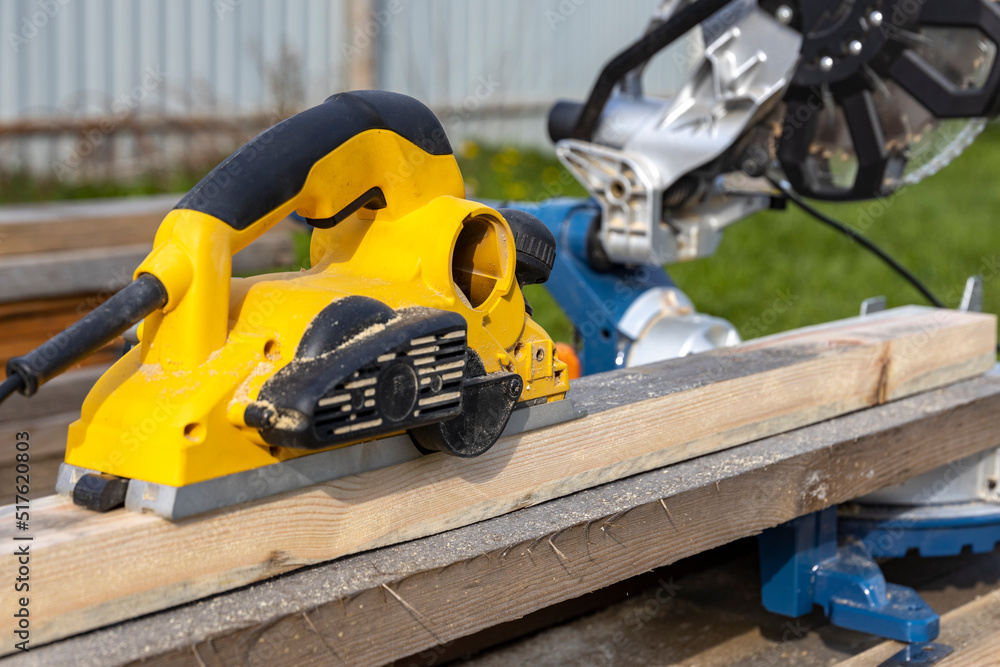 Planer close-up. Carpentry, Woodworking tool at work. Planer close-up. Carpentry, Woodworking tool at work.