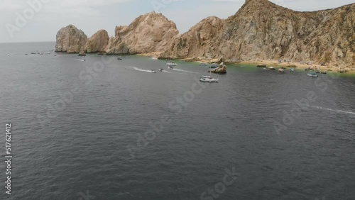 Off the green coral rich sea of Cortez,  a steady stream of boats bring tourists to and from the remote sandy beaches of the tip of Baja Californian reside. photo