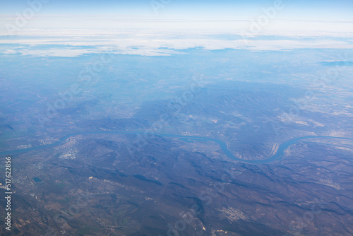 Panorama of Alps and Danube River view from above . Flying over the mountains 