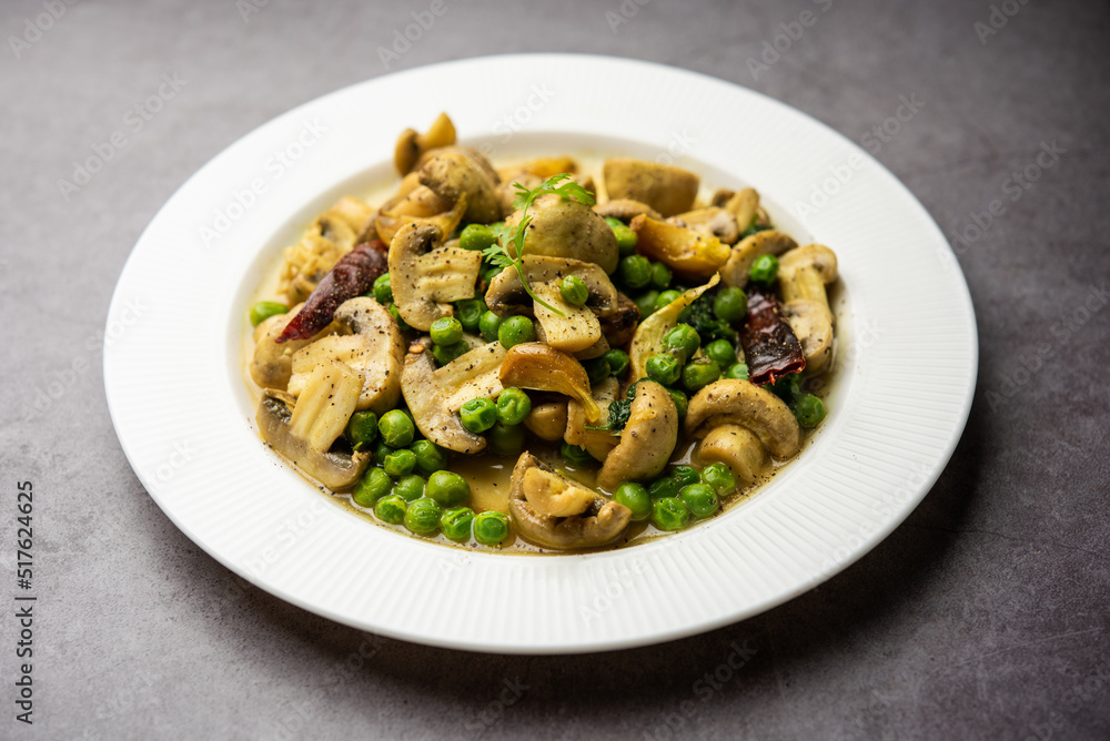 Mushroom and Pea Curry with Roasted Garlic, Indian food served in a bowl