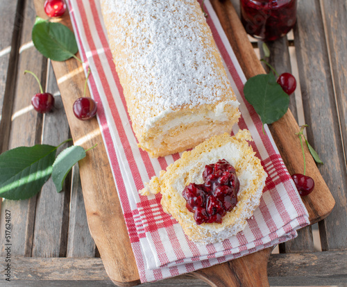 Swiss roll with sour cherry compote photo