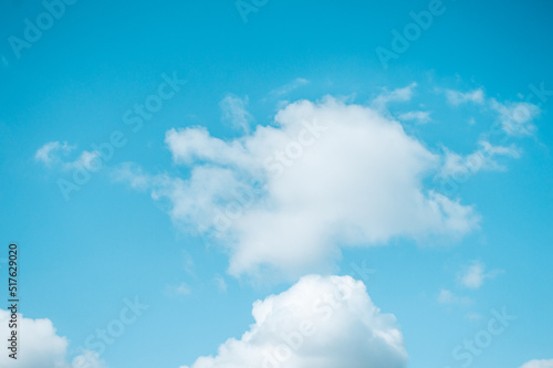Blue sky with white fluffy clouds Nature background