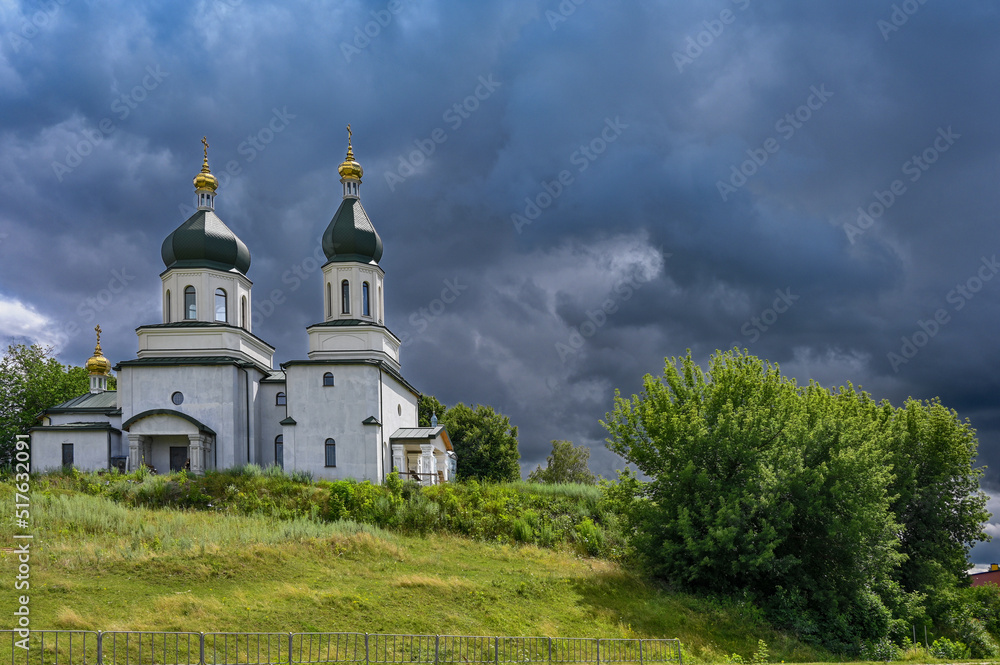 Orthodox church on the background of black clouds 