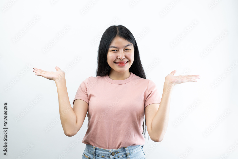 Happy Asian woman presenting or showing open hand palm with copy space for product isolated on white background Happy Asian woman presenting or showing open hand palm with copy space for product isolated on white background