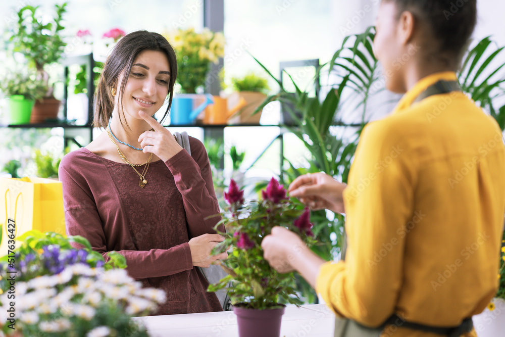 Woman buying a plant at the flower shop