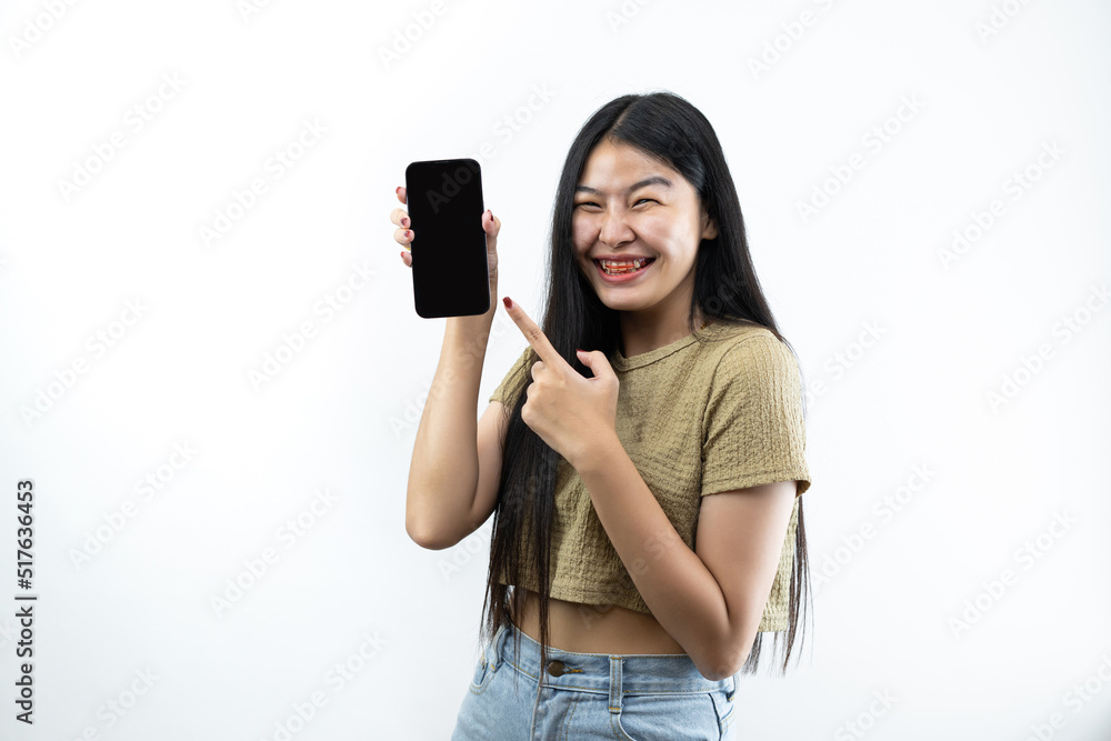 Young Asian teen woman showing smart phone isolated on white background. Young Asian teen woman showing smart phone isolated on white background.