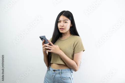Young Asian teen woman showing smart phone isolated on white background.