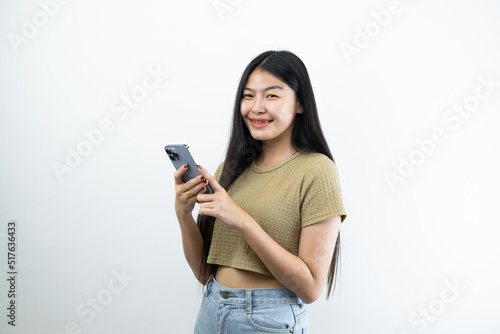 Young Asian teen woman showing smart phone isolated on white background.