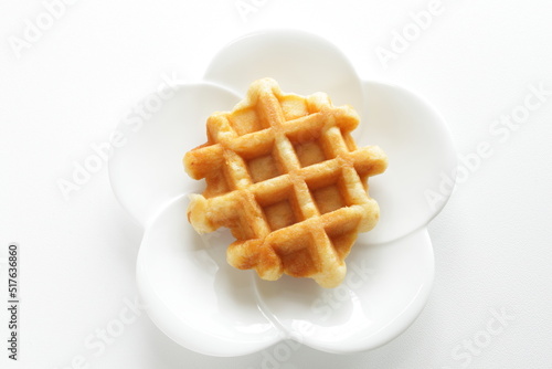 Belgium waffle on white plate for sweet breakfast 