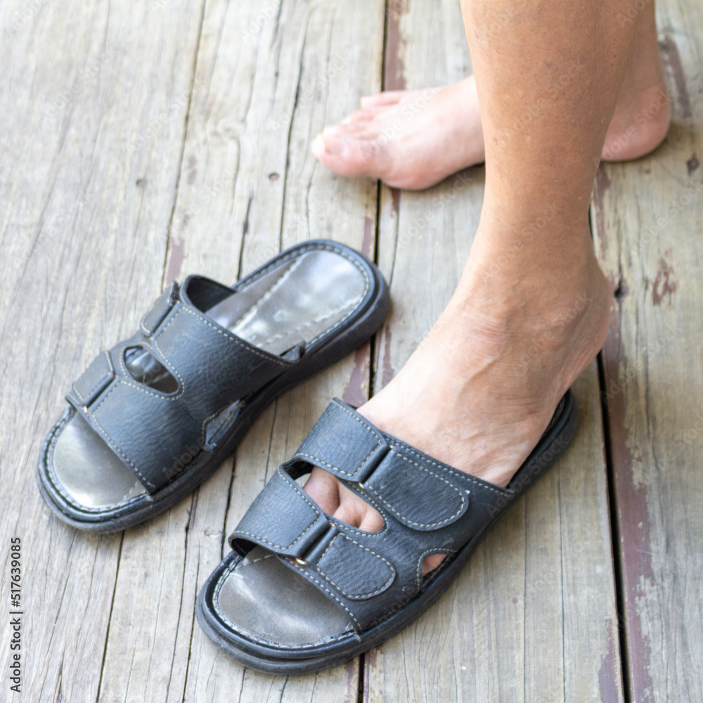 old man human floor wood sandals