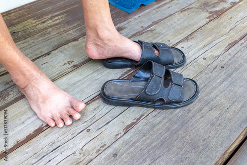 old man human floor wood sandals