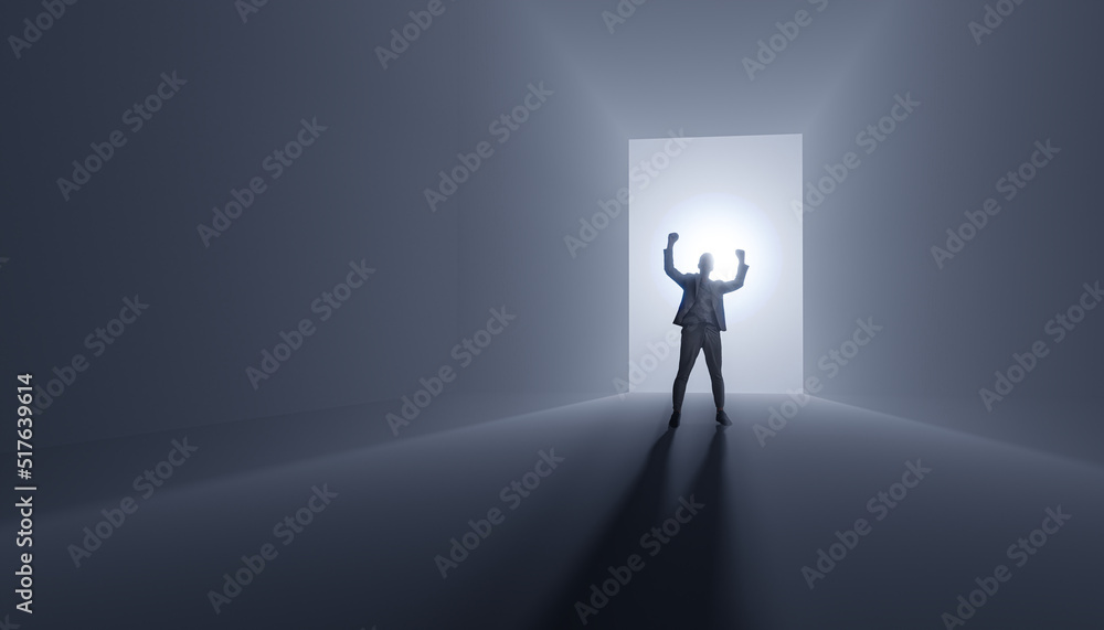 Obraz premium Businessman success - cheers success with raised hands against the background of light breaking through the door - concept of human success