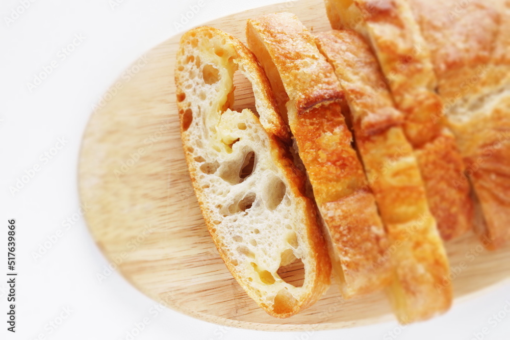 Sliced French bread on wooden board with copy space Sliced French bread on wooden board with copy space