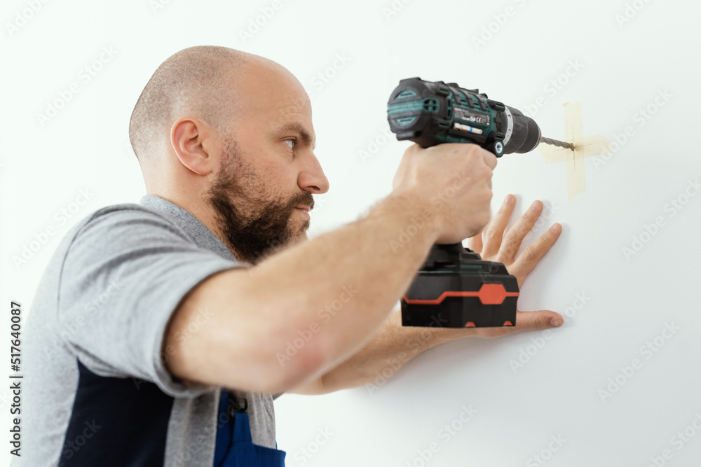 Professional handyman using a drill Professional handyman using a drill