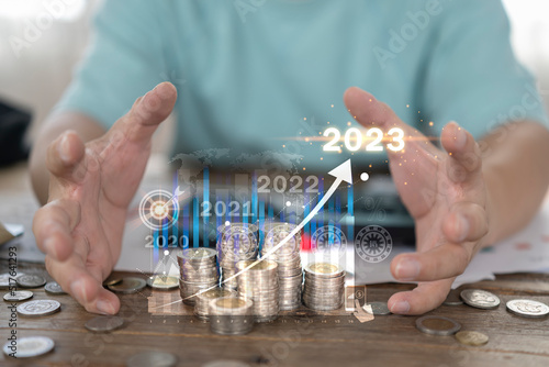 Concept of business finance and investment 2023 , Stock Market Investments growing with businessman investor 2023