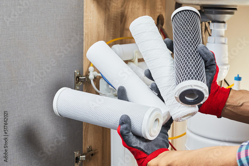 Bild auf Leinwand Water filter cartridge in human hand