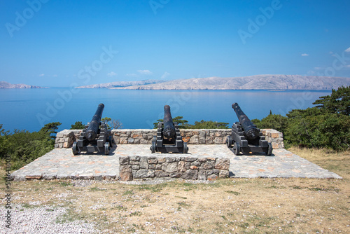 Three canons facing towards the sea in croatia. photo