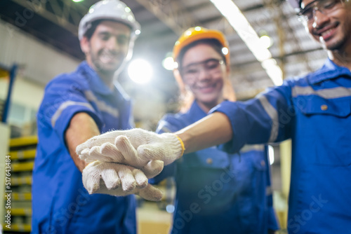 Group of young industrial people worker work in factory with happiness