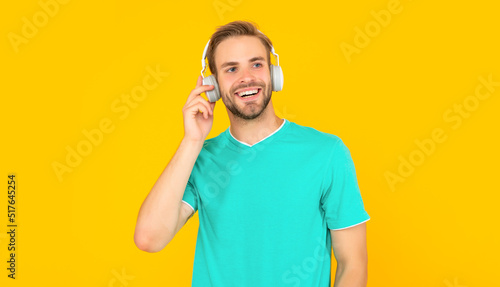happy man in modern earphones. online education. back to school. young guy in headphones.