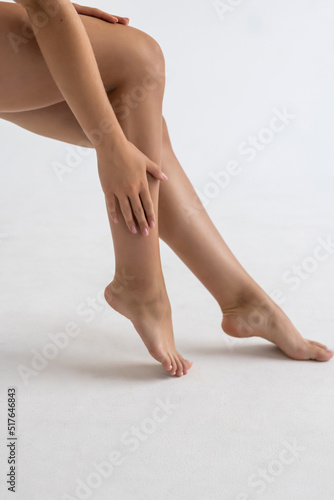Female legs. shot in studio. Beautiful smooth and shaved legs isolated on white background