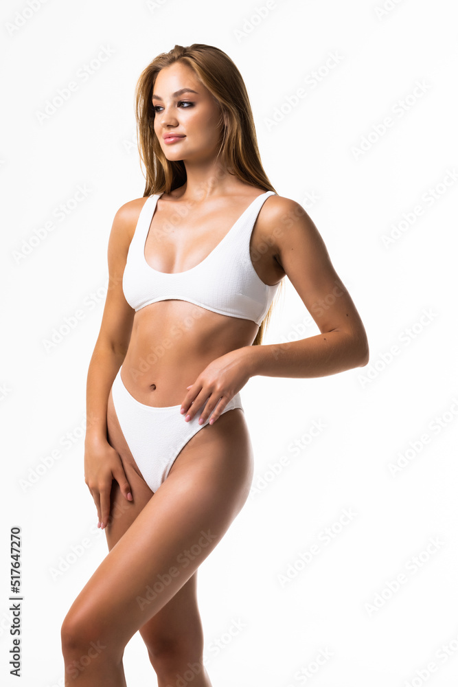 Fototapeta premium Sexy young girl in white lingerie on a white background. close up