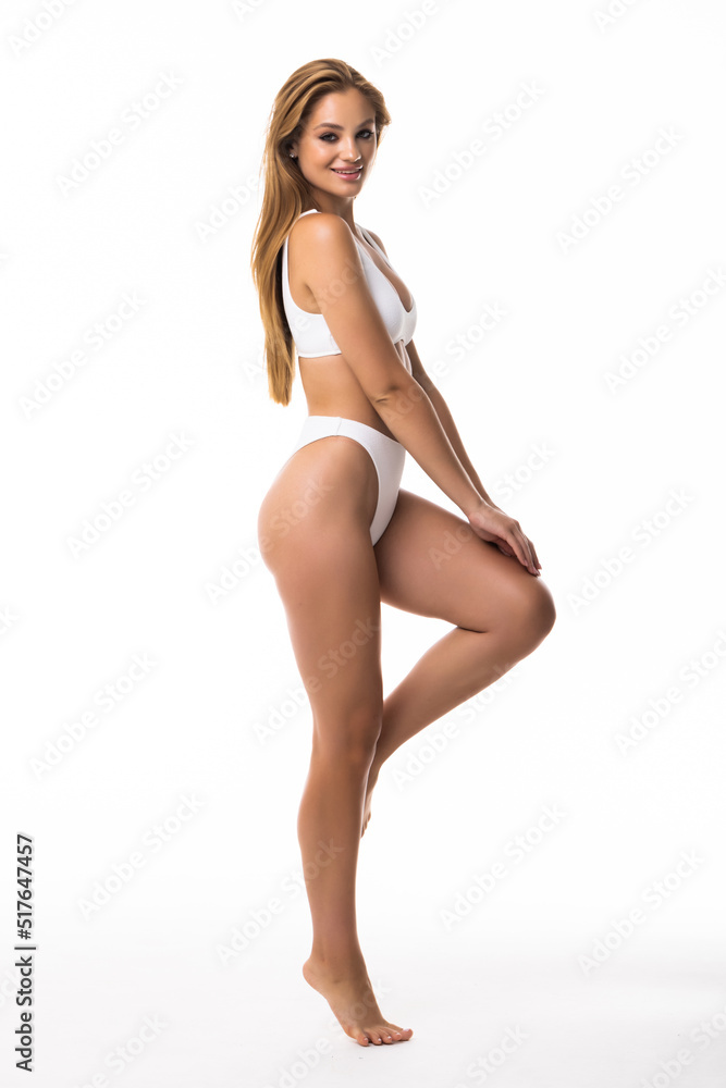 Full height of young pretty woman with perfect body standing on white background Full height of young pretty woman with perfect body standing on white background