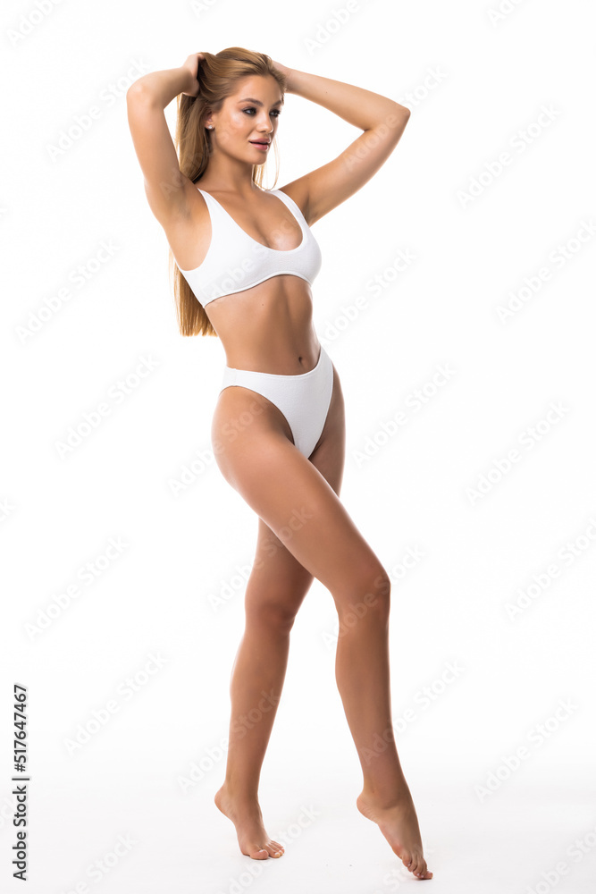 Full length portrait of smiling young woman in lingerie isolated on white background Full length portrait of smiling young woman in lingerie isolated on white background