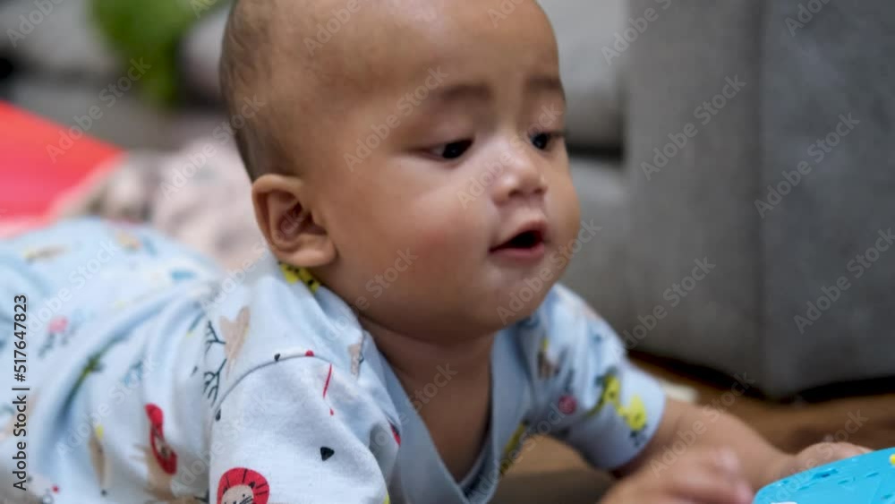 Asian baby boy show cute happy innocent expression at home. slow motion video Asian baby boy show cute happy innocent expression at home. slow motion video