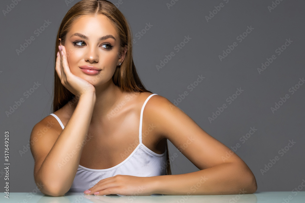 Beautiful woman skincare make up and cosmetics concept isolated grey color background Beautiful woman skincare make up and cosmetics concept isolated grey color background