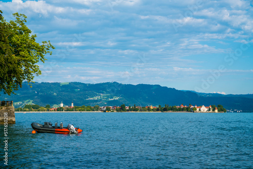 Obraz na płótnie Germany, Lindau city island in warm sunset sunlight from waterside, panorama landscape view to houses and pfaender mountain at lake constance w salonie