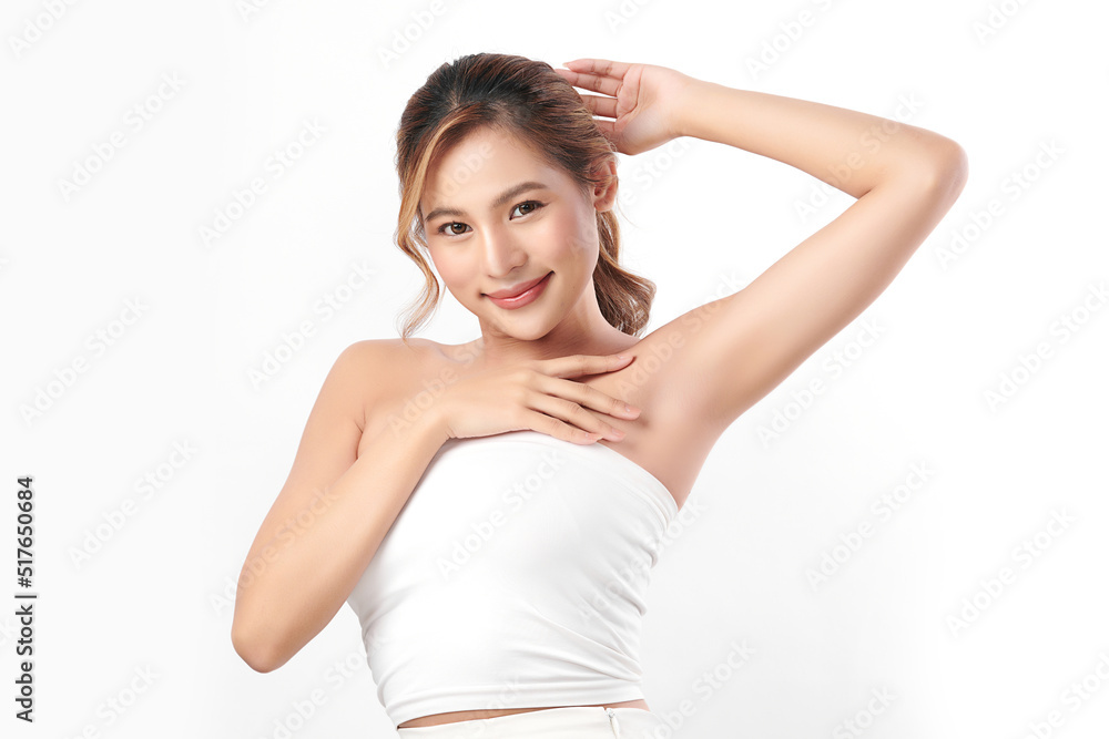 Beautiful Young Asian woman lifting hands up to show off clean and hygienic armpits or underarms on white background, Smooth armpit cleanliness and protection concept Beautiful Young Asian woman lifting hands up to show off clean and hygienic armpits or underarms on white background, Smooth armpit cleanliness and protection concept