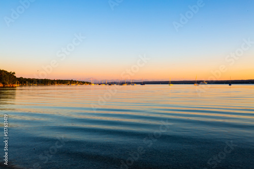 Ammersee in summer, with pedal boats and steamboat