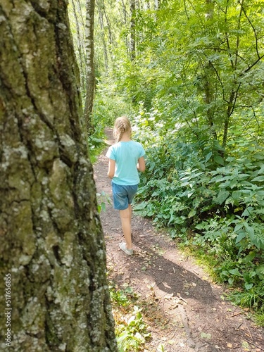 child walking in the forest