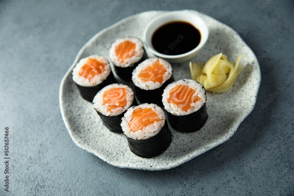 Homemade salmon maki rolls with soy sauce Homemade salmon maki rolls with soy sauce