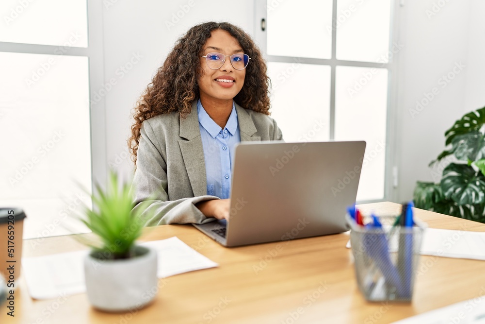 Young latin woman smiling confident working at office Young latin woman smiling confident working at office