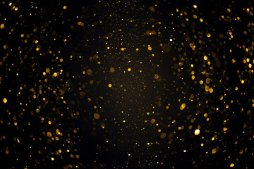 Swirly bokeh of gold glitter shimmer dust shiny particles dark abstract background