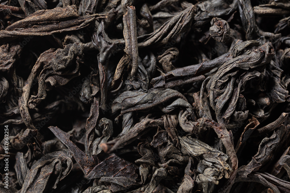 Dried black tea leaves as background. Dried black tea leaves as background.