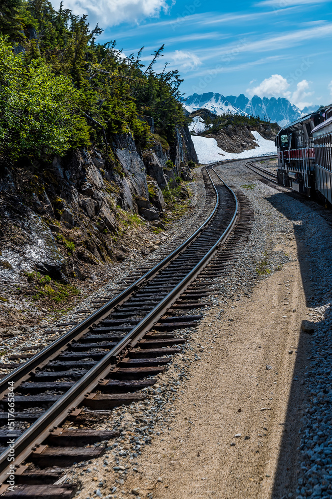 A view down the tracks at the highest point of the White Pass and Yukon railway near Skagway, Alaska in summertime