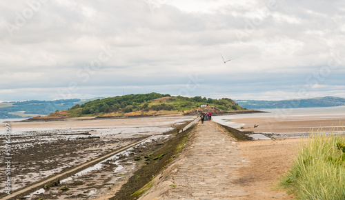 The causeway across the Firth of the Forth to Cramond Island in North East Scotland at low tide photo