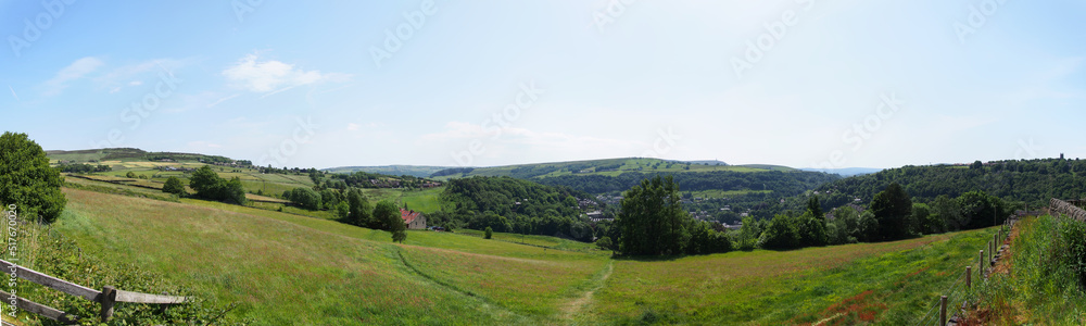 long panoramic view of the calder valley in west yorkshire with hebden bridge and heptonstall visible in the distance