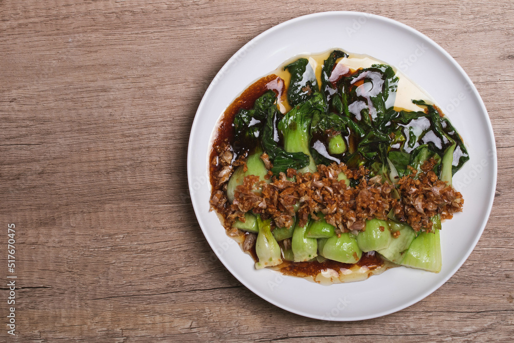 Baby Bok choy or chinese cabbage in oyster sauce with and fried garlic. Baby Bok choy or chinese cabbage in oyster sauce with and fried garlic.